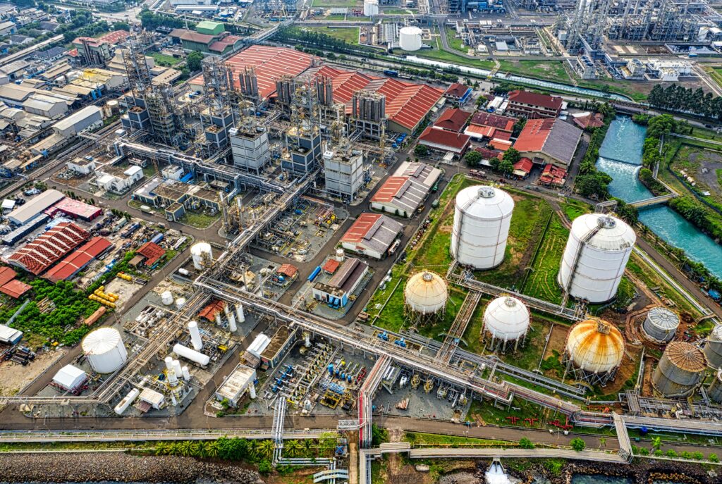 A detailed aerial view of an industrial facility in Banten, Indonesia, showcasing large tanks and architectural structures.
